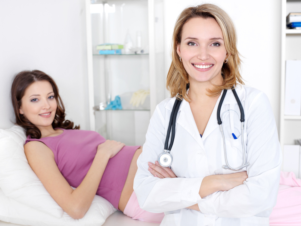 smiling-doctor-young-pregnant-woman-hospital-pregnancy_test